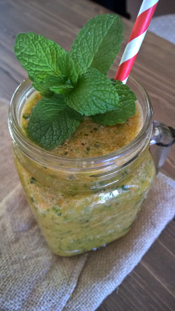 Antioxidant Cocktail with kale, mint, apple, orange, carrot, cucumber, turmeric, ginger, cayenne and chili